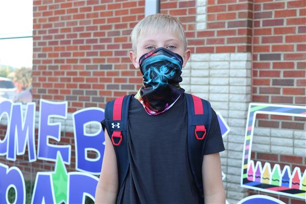 student smiles on first day of school